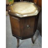 Reproduction mahogany octagonal cellarette or cabinet with leather top, hinged lid on outswept legs.