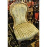 Victorian walnut upholstered serpentine upholstered nursing chair. (B.P. 21% + VAT)