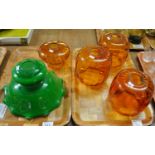 Four amber glass light shades and one green glass light shade. (5) (B.P. 21% + VAT) One of the amber