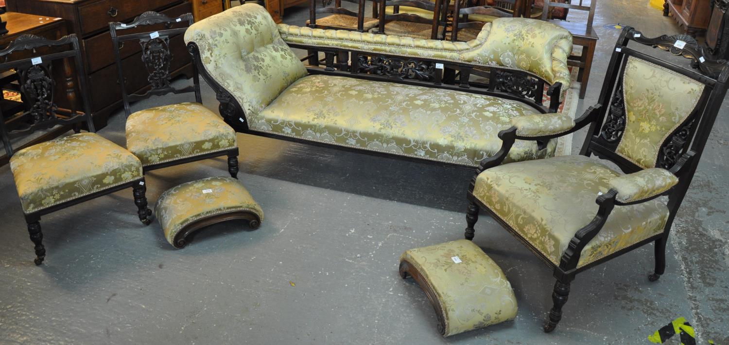 Edwardian ebonised and upholstered parlour suite comprising; chaise longue, pair of side chairs