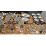 Two trays of drinking glasses to include: six German beer glasses, four of frosted glass with