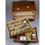 Small table top three drawer jewellery or collectors cabinet comprising two watches and various