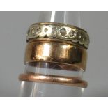 Three 9ct gold rings comprising two wedding rings and an eternity ring. Ring size J, M and P. Approx