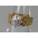 18ct gold diamond cluster ring with bark effect shank. Ring size L. Approx weight 7.8 grams. (B.P.