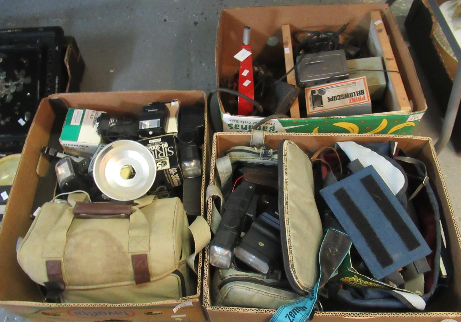 Three boxes of assorted cameras and camera equipment to include; various canvas camera bags, various