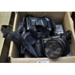 Box of cameras and accessories to include Canon Powershot G5, Canon Powershot pro1, cables, etc. (
