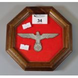 Framed and glazed German WWII style Nazi winged eagle insignia. (B.P. 21% + VAT)