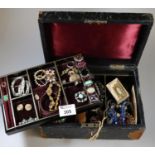 A leather covered jewellery box with velvet interior containing various costume jewellery