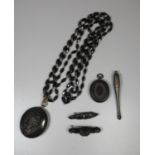 Collection of Victorian jet jewellery comprising, two lockets one with black glass beads, two