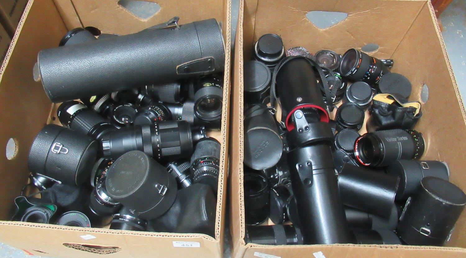 Two boxes of camera lenses, some in cases to include; Vivitar, Tamron, Yashica, Kiron, Olympus,