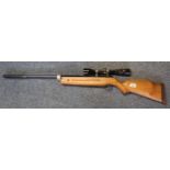 Theoben .22 air rifle marked PH England to stock, with telescopic sight marked Hunter 3X-9X 40