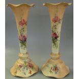 Pair of Royal Worcester blush ivory porcelain vases of trumpet form, hand painted with foliage and