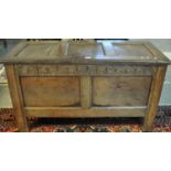 18th Century Welsh oak coffer, the lid with three fielded panels above a carved foliate frieze and