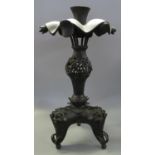 Chinese patinated bronze torchere or pedestal censer having waved rim with foliate mounts, pierced