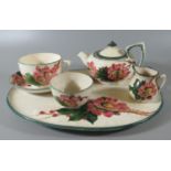 Llanelly pottery Shufflebotham decorated wild rose design cabaret teaset, comprising; cup and