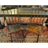 Two similar late 19th/early 20th Century Welsh primitive stick backed fireside armchairs, both