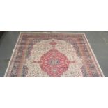 Full pile ivory ground Kashmir carpet with central floral and foliate panel flanked by floral,