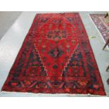 Red and blue ground thick pile Persian village rug, having geometric and stylised floral and foliate