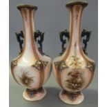 Pair of Hadley's Worcester Faience two handled vases painted in sepia with birds and foliage,