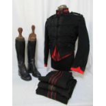 19th Century black military uniform having short jacket with braid decoration, red braided under