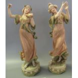 Pair of Art Nouveau Royal Dux porcelain figurines depicting female musical dancers, one with violin,