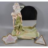 Royal Dux Art Nouveau porcelain dressing table mirror modelled as a girl taking off her shoes with a