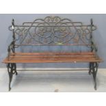 Early 20th Century cast iron garden seat overall decorated with trailing vines and grapes in an