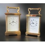 Two French brass carriage clocks marked Matthew Norman London and E.A Barker London. Each with