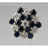 18ct gold sapphire and diamond cluster ring designed as a snowflake. Ring size I&1/2. Approx