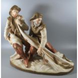 Royal Dux Art Nouveau porcelain figure group of two fishermen hauling in their catch with a net on