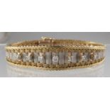 9ct white and yellow gold diamond set bracelet. Approx weight 19.5 grams. (B.P. 21% + VAT)