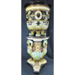 19th Century style pottery jardiniere and stand, overall relief decorated with foliate designs,