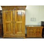 19th Century German Biedermeier design walnut wardrobe or armoire having moulded cornice above two