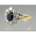 18ct gold sapphire and diamond cluster ring. Ring size W. Approx weight 4.9 grams. (B.P. 21% + VAT)
