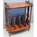 Victorian rosewood Canterbury with pierced splats and turned supports on brass casters. 66 x 42 x