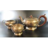 Edward VIII bachelors type silver three piece tea service to include; teapot, cream jug and two