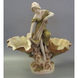 Art Nouveau Royal Dux porcelain table centrepiece modelled as a maiden perched on a naturalistic