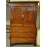 Early 19th Century Welsh oak two stage press cupboard, the moulded and herringbone inlaid cornice