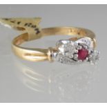 9ct gold ruby and diamond three stone ring. Ring size P. Approx weight 2.8 grams. (B.P. 21% + VAT)