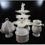 A collection of Royal creamware items to include; a puzzle jug, lidded tureens, some with pierced