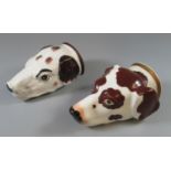 Two similar probably Staffordshire pottery large stirrup cups in the form of hounds heads. One