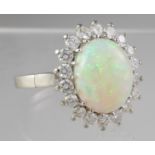 18ct white gold opal and diamond ring. Ring size P&1/2. Approx weight 6.3 grams. (B.P. 21% + VAT)