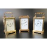 A group of three French brass carriage clocks, each with full depth enamel Roman dial. 11cm high