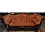 Victorian mahogany button back upholstered double ended sofa, the carved foliate and shaped back