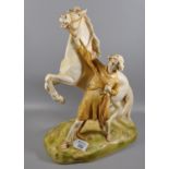 Royal Dux Art Nouveau porcelain figure group of a rearing horse with young girl on naturalistic