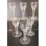 A set of six 19th Century wine glasses with thumb cut bowls and facet cut stems on circular bases