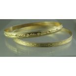 Two 9ct gold engraved bangles. Width 5mm and 4mm. Approx weight in total 16.5 grams. (B.P. 21% +