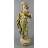 Royal Dux Art Nouveau porcelain figure modelled by F. Otto of a young man in green trousers with