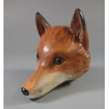 A large porcelain fox mask stirrup cup marked 'The Duke of Rutland and Success to His Hounds'. (B.P.