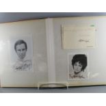 Autograph book containing signed photographs and letters from movie stars and entertainment figures,